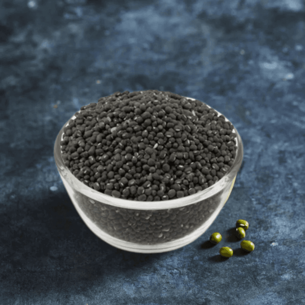 Black Mung Bean Seeds for Sprouting in a clear glass bowl on a dark surface. Ideal for home sprouting, rich in protein and antioxidants.