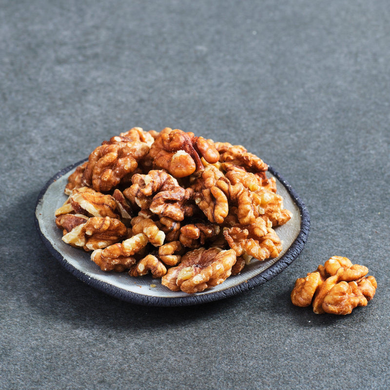 Organic Raw Walnuts Halves and Pieces in a bowl